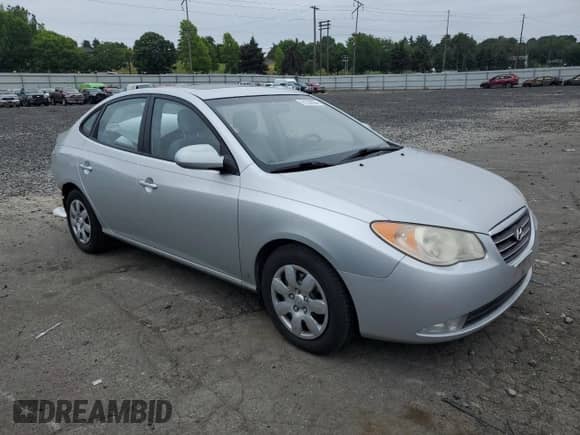 2007 Hyundai Elantra GLS with VIN KMHDU46DX7U084981, listed as a Copart auction lot 61230984 with 93,887 mi miles and Salvage title. Bid and sale history available at DreamBid. Image 4.