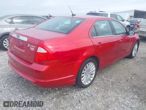 ✅ 2011 Ford Fusion Hybrid • VIN: 3FADP0L39BR308022 • Lot: 42351594. Listed on IAAI with 166,294 mi. Free auction sales archive from the USA and detailed vehicle history report at DreamBid. Image 4.