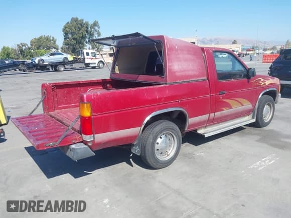 ✅ 1993 Nissan Frontier • VIN: 1N6SD11S5PC337045 • Lot: 43106354. Listed on IAAI with 142,131 mi. Free auction sales archive from the USA and detailed vehicle history report at DreamBid. Image 4.