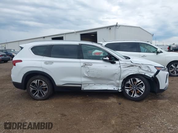 ✅ 2020 Hyundai Santa Fe Limited • VIN: 5NMS5CAA7LH182626 • Лот: 42678485. Опубликован ранее на IAAI с пробегом 71 573 миль. Бесплатный доступ к архиву аукционных продаж из США и подробный отчёт об истории автомобиля на DreamBid. Изображение 13.