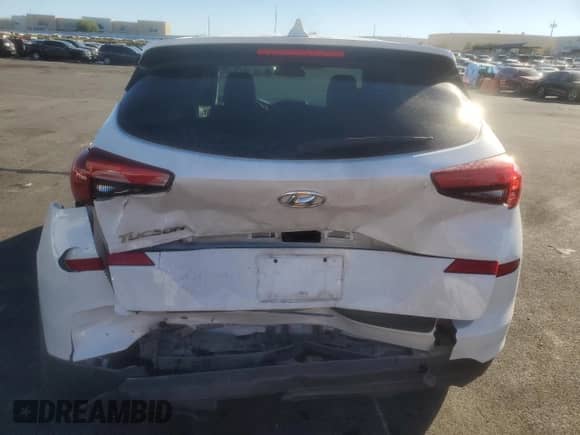 2019 Hyundai Tucson SE с VIN KM8J23A43KU975620, выставлен на аукционе Copart как лот 90310345 с пробегом 88 902 миль миль и Списание • Salvage title. История ставок и продаж доступна на DreamBid. Изображение 6.