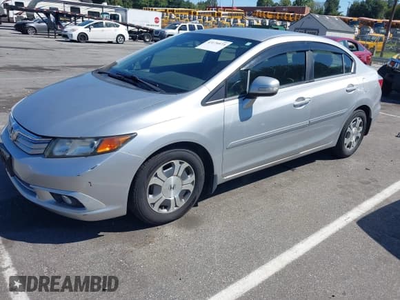 ✅ 2012 Honda Civic • VIN: JHMFB4F30CS007969 • Lot: 43179573. Listed on IAAI with 126,937 mi. Free auction sales archive from the USA and detailed vehicle history report at DreamBid. Image 2.