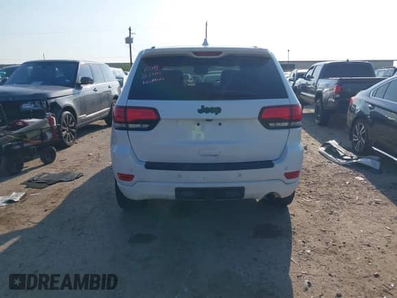 2022 Jeep Grand Cherokee Laredo E with VIN 1C4RJEAGXNC127857, listed as a IAAI auction lot 43202403 with 66,201 mi miles and . Bid and sale history available at DreamBid. Image 16.