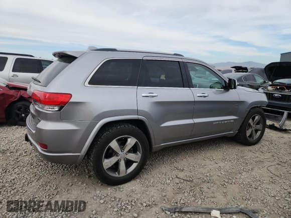 ✅ 2014 Jeep Grand Cherokee Overland • VIN: 1C4RJFCM5EC582804 • Lot: 81133285. Listed on Copart with 95,810 mi. Free auction sales archive from the USA and detailed vehicle history report at DreamBid. Image 3.