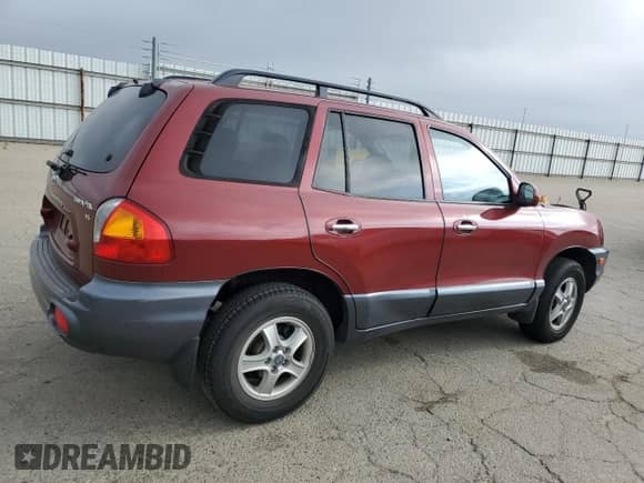 2002 Hyundai Santa Fe GLS z VIN KM8SC13D02U173092, wystawiony jako Copart lot #87683115 z przebiegiem 96 950 mil mil oraz Szkoda całkowita • Salvage title. Historia ofert i sprzedaży dostępna na DreamBid. Obrazek 3.