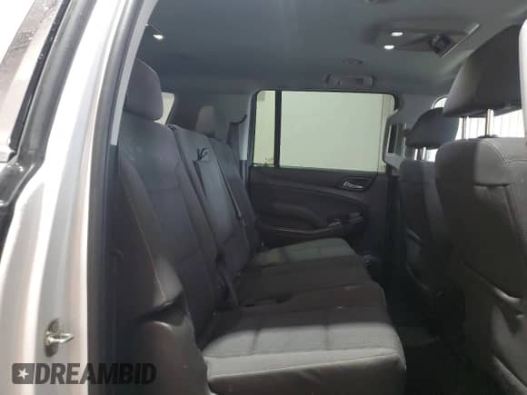 2018 Chevrolet Suburban LS z VIN 1GNSKGECXJR137675, wystawiony jako Copart lot #71902125 z przebiegiem 128 007 mil mil oraz Szkoda całkowita • Salvage title. Historia ofert i sprzedaży dostępna na DreamBid. Obrazek 11.