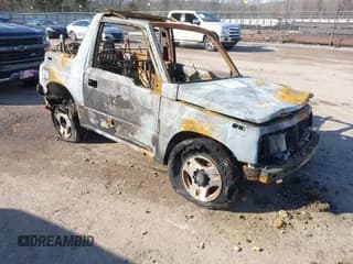 ✅ 1996 Chevrolet Tracker • VIN: 2CNBJ1869T6914128 • Лот: 41399004. Опубликован ранее на IAAI с пробегом Не указан. Бесплатный доступ к архиву аукционных продаж из США и подробный отчёт об истории автомобиля на DreamBid. Изображение 1.