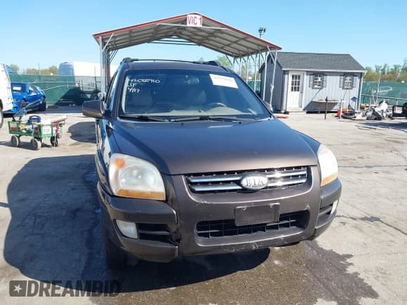 ✅ 2006 Kia Sportage LX • VIN: KNDJE723267219158 • Lot: 42055910. Listed on IAAI with 156,906 mi. Free auction sales archive from the USA and detailed vehicle history report at DreamBid. Image 12.