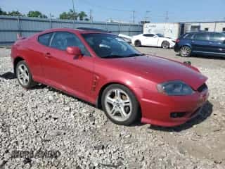 2006 Hyundai Tiburon GT с VIN KMHHN65FX6U190598, выставлен на аукционе Copart как лот 61143675 с пробегом Не указан миль и Списание • Salvage title. История ставок и продаж доступна на DreamBid. Изображение 4.
