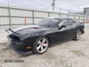 ✅ 2012 Dodge Challenger SRT-8 392 • VIN: 2C3CDYCJ9CH176411 • Lot: 42472935. Wystawiony na Copart z przebiegiem 83 919 mil. Bezpłatny archiwum sprzedaży aukcyjnych z USA i szczegółowy raport historii pojazdu na DreamBid. Zdjęcie 1.