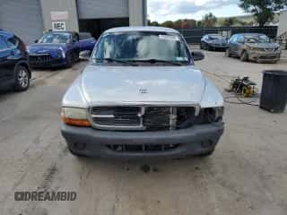 2004 Dodge Dakota z VIN 1D7FL16K24S621269, wystawiony jako Copart lot #75284304 z przebiegiem Nie podano mil oraz Szkoda całkowita • Salvage title. Historia ofert i sprzedaży dostępna na DreamBid. Obrazek 5.