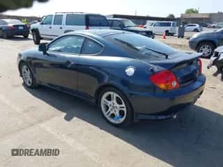 2003 Hyundai Tiburon GT с VIN KMHHN65F83U034197, выставлен на аукционе IAAI как лот 42383077 с пробегом 138 877 миль миль и . История ставок и продаж доступна на DreamBid. Изображение 3.