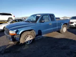 2003 Dodge Dakota Sport z VIN 1D7HL32X63S141658, wystawiony jako Copart lot #85207614 z przebiegiem 147 920 mil mil oraz Czysty tytuł • Clean title. Historia ofert i sprzedaży dostępna na DreamBid. Obrazek 1.