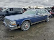 ✅ 1984 Cadillac Seville • VIN: 1G6AS6989EE809567 • Лот: 94370185. Опубликован ранее на Copart с пробегом 1 116 миль. Бесплатный доступ к архиву аукционных продаж из США и подробный отчёт об истории автомобиля на DreamBid. Изображение 1.