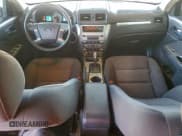 ✅ 2011 Ford Fusion Hybrid • VIN: 3FADP0L38BR335244 • Lot: 96187435. Wystawiony na Copart z przebiegiem 192 821 mil. Bezpłatny archiwum sprzedaży aukcyjnych z USA i szczegółowy raport historii pojazdu na DreamBid. Zdjęcie 8.