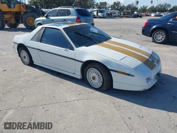 ✅ 1986 Pontiac Fiero • VIN: 1G2PF3797GP269850 • Лот: 40722755. Опубликован ранее на IAAI с пробегом 129 077 миль. Бесплатный доступ к архиву аукционных продаж из США и подробный отчёт об истории автомобиля на DreamBid. Изображение 1.