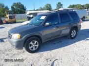 ✅ 2005 Mazda Tribute i • VIN: 4F2YZ02Z65KM48274 • Lot: 43129870. Listed on IAAI with 144,826 mi. Free auction sales archive from the USA and detailed vehicle history report at DreamBid. Image 2.