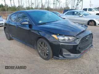 2019 Hyundai Veloster Turbo z VIN KMHTH6AB9KU005942, wystawiony jako IAAI lot #41565229 z przebiegiem 91 788 mil mil oraz . Historia ofert i sprzedaży dostępna na DreamBid. Obrazek 1.