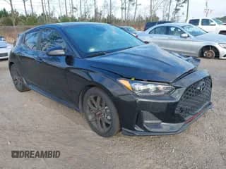 2019 Hyundai Veloster Turbo z VIN KMHTH6AB9KU005942, wystawiony jako IAAI lot #41565229 z przebiegiem 91 788 mil mil oraz . Historia ofert i sprzedaży dostępna na DreamBid. Obrazek 1.