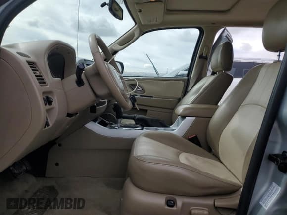 ✅ 2006 Mercury Mariner Hybrid • VIN: 4M2CU98H56KJ12607 • Lot: 51639875. Wystawiony na Copart z przebiegiem 136 352 mil. Bezpłatny archiwum sprzedaży aukcyjnych z USA i szczegółowy raport historii pojazdu na DreamBid. Zdjęcie 7.