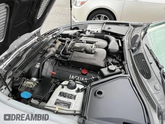 ✅ 2001 Jaguar XK • VIN: SAJDA42B71PA15810 • Lot: 83520864. Listed on Copart with 103,531 mi. Free auction sales archive from the USA and detailed vehicle history report at DreamBid. Image 7.