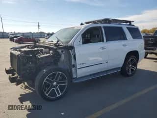 2015 Chevrolet Tahoe LTZ with VIN 1GNSKCKC1FR118128, listed as a Copart auction lot 89589135 with 129,932 mi miles and Salvage title. Bid and sale history available at DreamBid. Image 1.