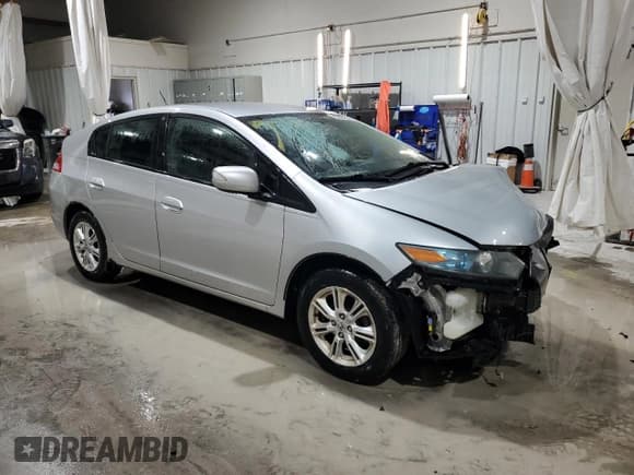 ✅ 2010 Honda Insight EX • VIN: JHMZE2H79AS002145 • Lot: 92627145. Listed on Copart with 144,749 mi. Free auction sales archive from the USA and detailed vehicle history report at DreamBid. Image 4.