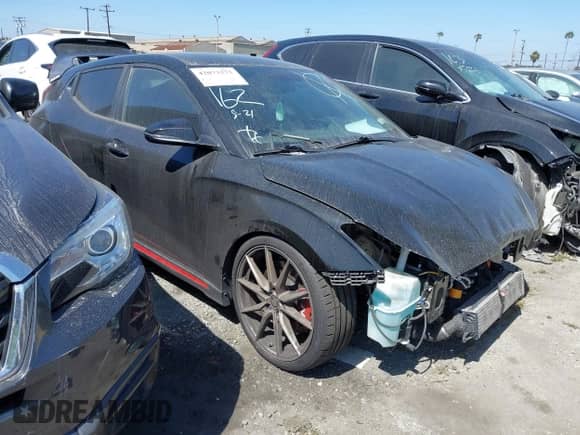 2020 Hyundai Veloster z VIN KMHT36AH1LU005437, wystawiony jako IAAI lot #42073273 z przebiegiem 97 089 mil mil oraz . Historia ofert i sprzedaży dostępna na DreamBid. Obrazek 1.