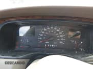 ✅ 1999 Lincoln Town Car Cartier • VIN: 1LNHM83W0XY673738 • Lot: 42437877. Listed on IAAI with 143,018 mi. Free auction sales archive from the USA and detailed vehicle history report at DreamBid. Image 7.