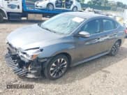 ✅ 2018 Nissan Sentra S • VIN: 3N1AB7AP0JY205055 • Lot: 42796985. Listed on IAAI with 15,456 mi. Free auction sales archive from the USA and detailed vehicle history report at DreamBid. Image 2.