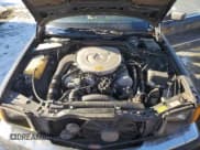 ✅ 1985 Mercedes-Benz 500 • VIN: WDBCA44D5FA143302 • Lot: 86618514. Wystawiony na Copart z przebiegiem 115 565 mil. Bezpłatny archiwum sprzedaży aukcyjnych z USA i szczegółowy raport historii pojazdu na DreamBid. Zdjęcie 11.