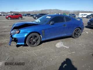 2005 Hyundai Tiburon GT z VIN KMHHN65F35U169736, wystawiony jako Copart lot #47422885 z przebiegiem 136 205 mil mil oraz Czysty tytuł • Clean title. Historia ofert i sprzedaży dostępna na DreamBid. Obrazek 1.