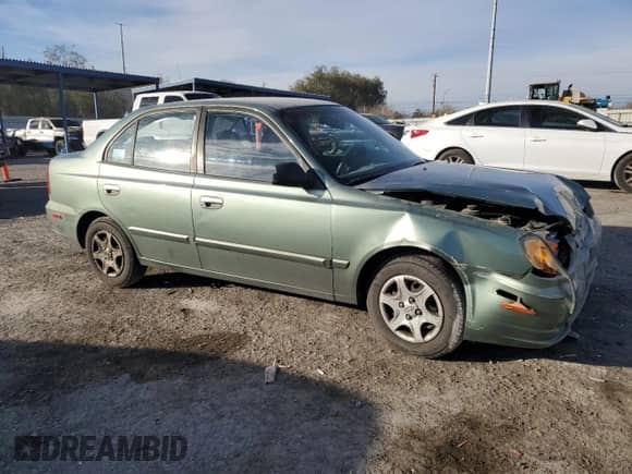 2004 Hyundai Accent GL z VIN KMHCG45C44U531828, wystawiony jako Copart lot #86428134 z przebiegiem 92 054 mil mil oraz Szkoda całkowita • Salvage title. Historia ofert i sprzedaży dostępna na DreamBid. Obrazek 4.