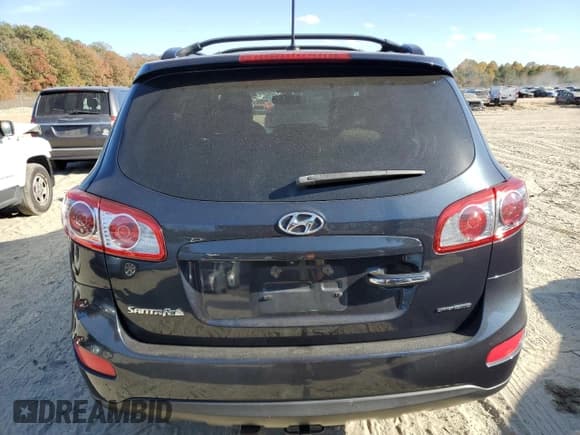 ✅ 2012 Hyundai Santa Fe Limited • VIN: 5XYZKDAG4CG118250 • Lot: 77872484. Listed on Copart with 165,557 mi. Free auction sales archive from the USA and detailed vehicle history report at DreamBid. Image 6.