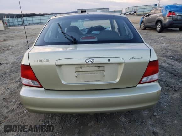 2001 Hyundai Accent GS z VIN KMHCG35C81U152921, wystawiony jako Copart lot #42519995 z przebiegiem 154 669 mil mil oraz Szkoda całkowita • Salvage title. Historia ofert i sprzedaży dostępna na DreamBid. Obrazek 6.