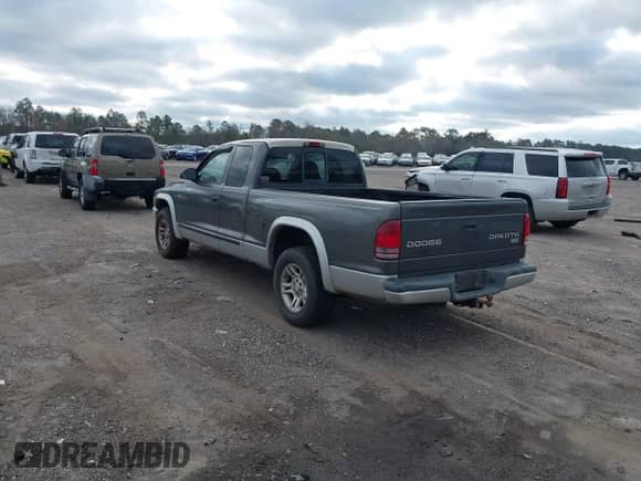 2003 Dodge Dakota SLT with VIN 1D7HL42N63S100130, listed as a IAAI auction lot 41419945 with 185,326 mi miles and . Bid and sale history available at DreamBid. Image 3.