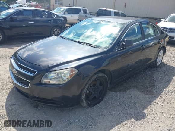 2012 Chevrolet Malibu 1LS z VIN 1G1ZB5E02CF301242, wystawiony jako IAAI lot #43411361 z przebiegiem 158 844 mil mil oraz . Historia ofert i sprzedaży dostępna na DreamBid. Obrazek 2.