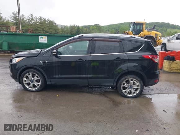 ✅ 2015 Ford Escape Titanium • VIN: 1FMCU9J95FUA75924 • Lot: 42329222. Listed on IAAI with 123,817 mi. Free auction sales archive from the USA and detailed vehicle history report at DreamBid. Image 14.