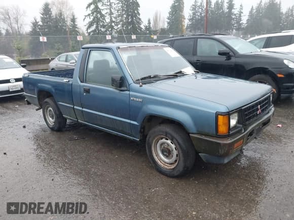 ✅ 1990 Mitsubishi Mighty Max • VIN: JA7FL24W1LP016860 • Лот: 43712602. Опубликован ранее на IAAI с пробегом 299 914 миль. Бесплатный доступ к архиву аукционных продаж из США и подробный отчёт об истории автомобиля на DreamBid. Изображение 1.