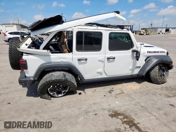 ✅ 2023 Jeep Wrangler Rubicon • VIN: 1C4HJXFG9PW534828 • Lot: 62022895. Listed on Copart with 20,476 mi. Free auction sales archive from the USA and detailed vehicle history report at DreamBid. Image 3.