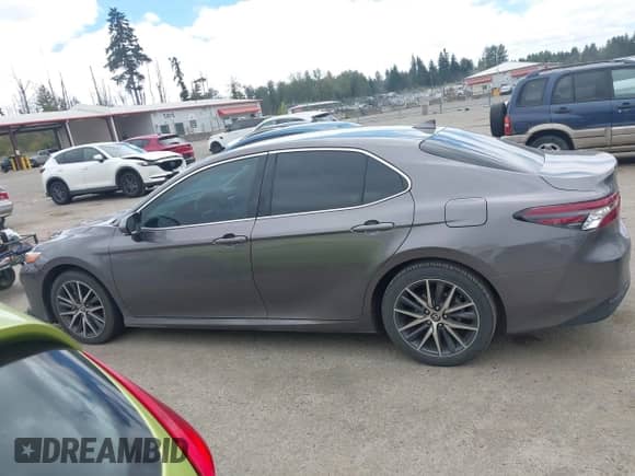 2022 Toyota Camry Hybrid XLE with VIN 4T1F31AK6NU575433, listed as a IAAI auction lot 42841689 with 65,526 mi miles and . Bid and sale history available at DreamBid. Image 14.