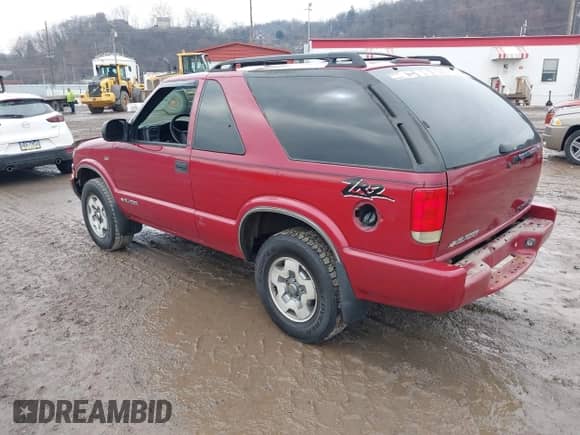 2003 Chevrolet Blazer LS z VIN 1GNCT18X93K171504, wystawiony jako IAAI lot #41682798 z przebiegiem 74 017 mil mil oraz . Historia ofert i sprzedaży dostępna na DreamBid. Obrazek 3.