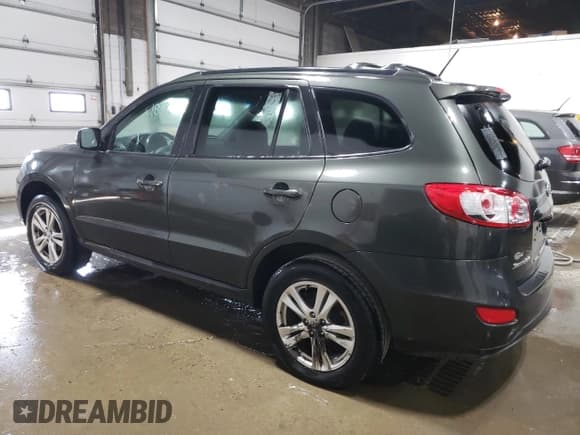 ✅ 2012 Hyundai Santa Fe SE • VIN: 5XYZH4AG3CG117525 • Lot: 75181374. Listed on Copart with 96,764 mi. Free auction sales archive from the USA and detailed vehicle history report at DreamBid. Image 2.
