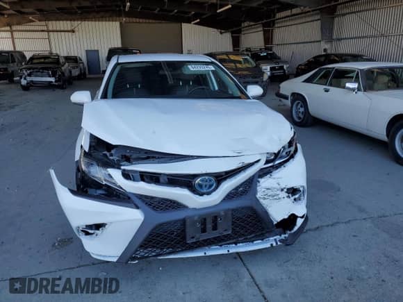 2020 Toyota Camry Hybrid SE с VIN 4T1G31AK3LU542830, выставлен на аукционе Copart как лот 84293245 с пробегом Не указан миль и Списание • Salvage title. История ставок и продаж доступна на DreamBid. Изображение 5.