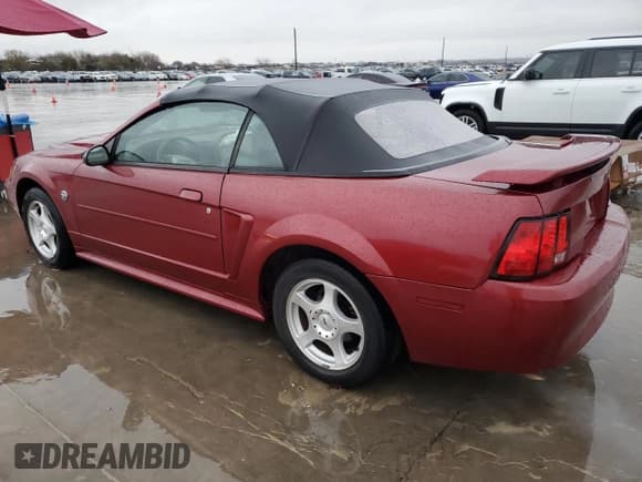 ✅ 2004 Ford Mustang Deluxe • VIN: 1FAFP444X4F112744 • Lot: 86508014. Listed on Copart with 131,560 mi. Free auction sales archive from the USA and detailed vehicle history report at DreamBid. Image 2.