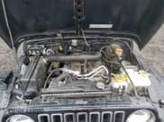 ✅ 2003 Jeep Wrangler Sahara • VIN: 1J4FA59S43P373475 • Lot: 95932865. Listed on Copart with 112,370 mi. Free auction sales archive from the USA and detailed vehicle history report at DreamBid. Image 11.