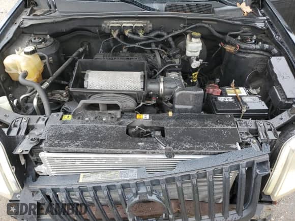 2010 Mercury Mariner Premier с VIN 4M2CN9HG7AKJ19586, выставлен на аукционе Copart как лот 80964085 с пробегом 192 530 миль миль и Списание • Salvage title. История ставок и продаж доступна на DreamBid. Изображение 12.