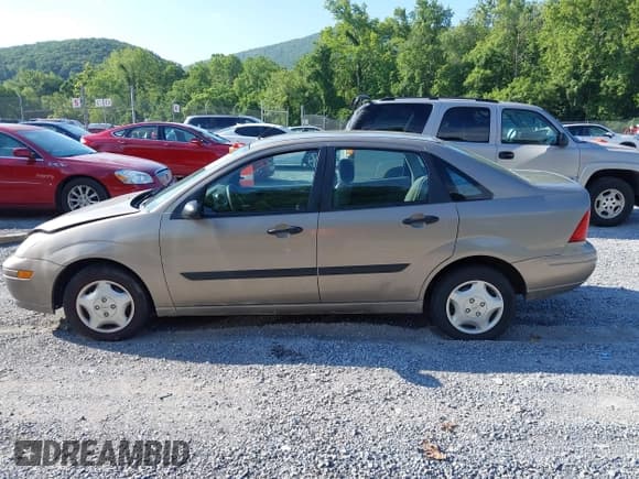 ✅ 2003 Ford Focus LX • VIN: 1FAFP33P63W324786 • Lot: 42693187. Wystawiony na IAAI z przebiegiem 128 597 mil. Bezpłatny archiwum sprzedaży aukcyjnych z USA i szczegółowy raport historii pojazdu na DreamBid. Zdjęcie 15.