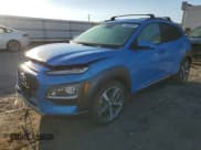✅ 2019 Hyundai Kona Ultimate • VIN: KM8K53A52KU371125 • Лот: 76848234. Опубликован ранее на Copart с пробегом 82 074 миль. Бесплатный доступ к архиву аукционных продаж из США и подробный отчёт об истории автомобиля на DreamBid. Изображение 1.