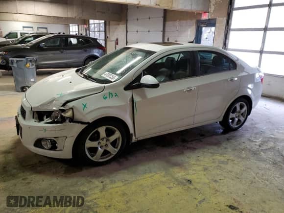 2012 Chevrolet Sonic LTZ with VIN 1G1JE5SH9C4143735, listed as a Copart auction lot 47083355 with 109,585 mi miles and Salvage title. Bid and sale history available at DreamBid. Image 1.